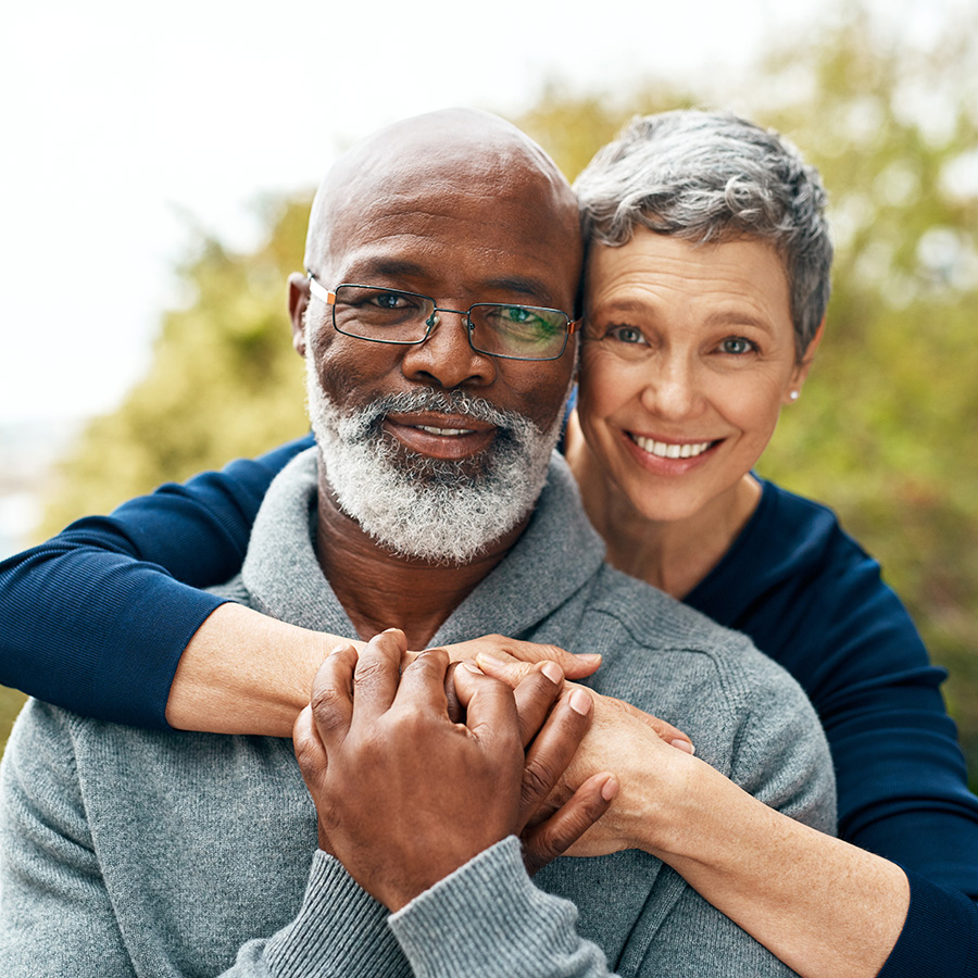 A couple embracing outside