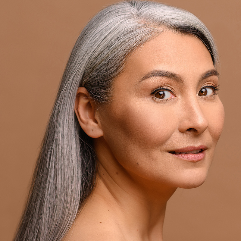 Mature woman in grey hair